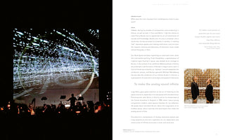 A two-page spread from a book. On the left, an orchestra is silhouetted against a large screen displaying a digital projection of a grid of white lights receding into perspective. A conductor stands on a podium. On the right is a page of text with a small photo of two men standing in an anechoic chamber.