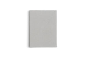 A light gray, rectangular object with a textured cloth cover is shown vertically against a white background, casting a soft shadow to its left.
