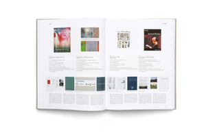 An overhead photograph of an open art book, showing a two-page spread with pages numbered 118 and 119. The pages feature color images of artworks and book covers by Gerhard Richter, alongside columns of descriptive German text against a white background. The years 2004 and 2004/2005 are printed at the top.