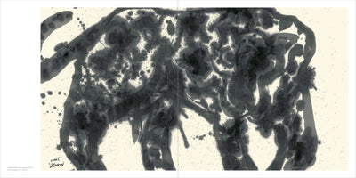An abstract painting of a leopard in black ink, displayed across two pages of a book. The animal is shown in profile, its powerful form and spotted coat created with energetic, fluid washes, splatters, and pools of ink on a light-colored paper.
