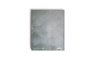The back cover of a hardcover book with a textured, mottled grey surface, shot against a plain white background. The bottom portion of the cover features two columns of white text describing the book's contents, publisher logos for Kunsthalle München and Hatje Cantz, and a barcode.