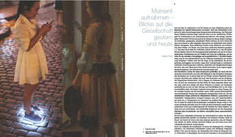 A two-page spread from a German book juxtaposing a modern photograph with a classical painting. On the left, a young woman in a white dress and light-up sneakers stands on a cobblestone street at night, her face illuminated by her smartphone. Next to her is a detail from a painting of a woman in historical attire, similarly absorbed in reading a letter. The right page contains a German article titled, Snapshots – Views of Society Yesterday and Today.