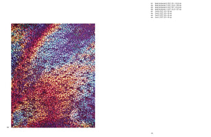 A two-page spread from a book. The left page displays a square, abstract artwork with a shimmering, textured surface. The colors create an iridescent effect, transitioning diagonally from warm reds and oranges to cool purples and blues. The right page is mostly blank, with a list of artwork titles and dimensions in the top right corner.