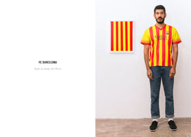 A man with a beard wearing a yellow and red striped FC Barcelona jersey stands in a white room next to a framed painting of identical yellow and red vertical stripes. To the left of the scene is a text panel identifying the artwork as FC BARCELONA.