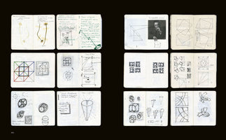 An overhead view of twelve open sketchbook pages arranged in a grid on a black background. The pages feature a mix of handwritten notes, pressed flowers, and numerous hand-drawn sketches and diagrams, including geometric explorations of cubes and squares, abstract patterns, and a small pasted-in photograph of a man.