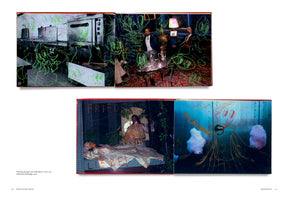 An open art book displays two diptychs. The top pair of photos, one of a commercial kitchen and one of two men in a formal room, is covered in neon green and pink doodles. The bottom pair shows a theatrical scene with two people in elaborate costumes, and a close-up of a blue surface with childlike drawings and pink cotton-like puffs.