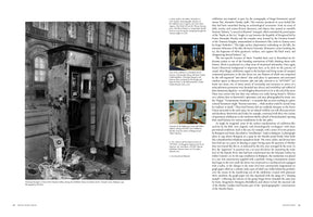 A two-page book spread with text and images. The left page features a large black-and-white photo of a woman in a long coat, Véronique Bourgoin, standing on a city street next to an open, weathered utility box filled with wires and electronic equipment. The right page contains two columns of text and two smaller, color photographs of different art installations.