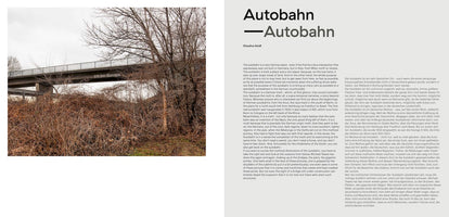 A two-page spread from a book or magazine. The left page shows a full-bleed photo of a concrete overpass in a bleak winter landscape, with the German text Ich bin Europa written on its side. The right page features the title Autobahn and text in two columns, English and German, discussing the highway system.