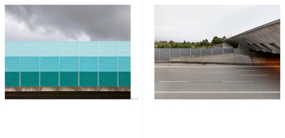 A two-page photo spread contrasting highway scenes under overcast skies. On the left, a sound barrier wall is painted in three horizontal bands of teal, from light to dark. On the right, an empty asphalt road runs alongside a grey metal barrier and a large, angular concrete overpass.