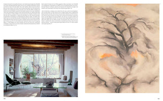 A two-page book spread. On the left is a photograph of a modern living room with a large window looking out onto a gnarled, bare tree. On the right is Georgia O'Keeffe's abstract painting, Winter Trees, Abiquiu, depicting the dark, twisted branches of a tree against a soft, swirling background of grey, white, and pale orange.