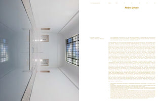 A two-page spread from a publication. The left page features a full-bleed, vertically-oriented photograph of a stark white, multi-level architectural interior shot from a low angle looking up. The right page contains text under the title Nebel Leben.
