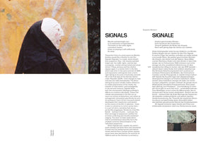 A page from a book or catalog with an article titled SIGNALS in English and SIGNALE in German. On the left is a large photo of a person in profile wearing a black hooded robe and a crude white mask with rosy cheeks. The right side features two columns of text and a small photo at the bottom.