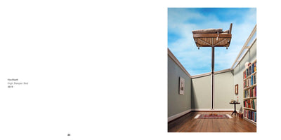 A two-page spread from a book. The left page has text for the artwork: Hochbett, High Sleeper Bed, 2019. The right page shows a surreal photograph of a room where a wooden bed sits on an extremely tall pole, so high that it breaks through the ceiling into a bright blue sky with clouds. The room below has light green walls, a wooden floor, a bookshelf, and a small rug.
