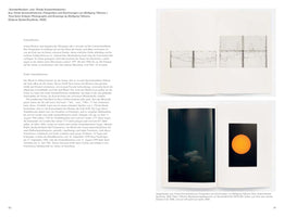 An open book showing pages 40 and 41 from Wolfgang Tillmans' publication, Total Solar Eclipse. The left page is filled with German text. The right page displays two other open-book spreads. The top one shows line graphs of solar activity. The bottom one displays two photos: a dark sky with clouds on the left, and a close-up of the orange sun with visible sunspots on the right.