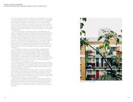 A page from a book showing German text on the left and a color photograph on the right. The photo is a close-up of a tree branch with a small, unripe green apple. A handwritten sticky note is attached to the apple with the text PLEASE leave this one!. In the background, apartment buildings are out of focus under a white sky. The caption below reads: Please leave this one (day), 2002.