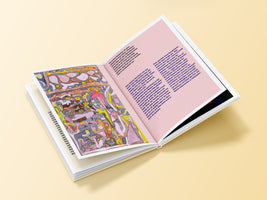 An open hardcover book lies on a pale yellow surface. The left page features a colorful, abstract illustration in a childlike style, while the right page contains German text printed in magenta on a light pink, patterned background.