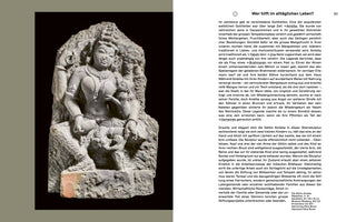 A book page displaying an 11th-century sandstone sculpture of the Jain goddess Ambika from Rajasthan. The seated goddess serenely holds a small child, with another beside her. The unfinished sculpture is shown on the left against a black background, with a column of descriptive German text on the right.