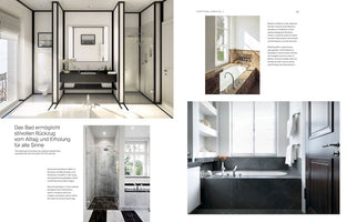 A page from an interior design magazine, Exceptional Homes Vol. 2, displaying four photos of luxurious bathrooms. The largest image shows a bright, modern bathroom with white walls and floors, contrasted by black framing that separates a vanity, toilet, and walk-in shower. The three smaller photos showcase elegant bathtubs and a walk-in shower detailed with various types of marble, including black, grey, and brown.