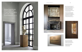 A two-page magazine spread on architecture and artistry. The left page shows a room with a tall, black-framed arched window, a classical bust on a pedestal, and a stone doorway. The right page features a dark marble fireplace with a large distressed mirror, along with smaller images of a bronze doorbell and a nameplate for Ralf Schmitz.