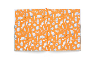 An open book laid flat reveals illustrated endpapers with a vibrant orange background. A repeating pattern of black-and-white line drawings covers the pages, featuring whimsical illustrations of people, vintage cars, clocks, scissors, eyeglasses, and symbols of Judaica, including a Star of David with the word Jude.