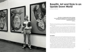 A black-and-white photograph on a book page shows artist Georg Baselitz in a gallery, standing next to his large, expressionist portraits that are hung upside down. The text on the right of the spread is titled, Baselitz: Art and Style in an Upside Down World.