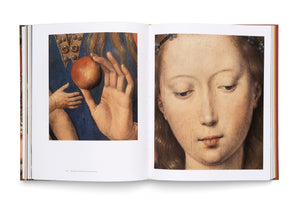 An open art book on a white surface displays a two-page spread of a classical painting. The left page shows a close-up of a hand in an ornate blue and gold garment holding a red apple. The right page is a close-up of a young woman's face with fair skin and brown hair, looking down with a solemn expression.