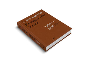 A thick, brown hardcover book titled Josef Albers Homage to the Square, 1950-1976, is displayed at an angle on a white background. The book has a textured cover with white and black text, and the title is also visible on the spine.