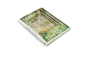 A photograph of a book titled Making The Plus, published by Hatje Cantz. The book is lying at an angle on a white background. The cover features an image of a modern building's interior with green structural beams, large windows looking out onto a forest, and a shiny, green-tinted floor.