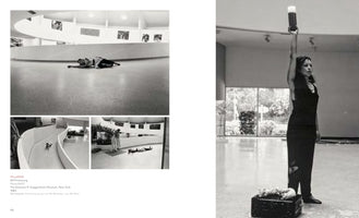 A book page layout with four black and white photographs documenting the 1983 performance art piece MeasuRAGE at the Guggenheim Museum. The images show women in various poses within the museum's distinctive architecture: lying on the curved floor and ramp, looking through a surveying instrument, and standing while holding a large cylindrical container high in the air.
