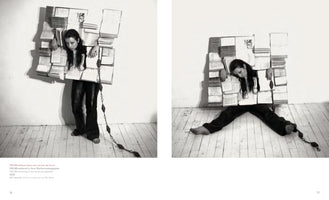 A black and white diptych showing two photographs of a performance piece by the artist ORLAN. In the left image, she stands barefoot, encased in a rigid, rectangular straitjacket made of books. In the right image, she is slumped on the wooden floor, appearing exhausted while still trapped within the book structure.