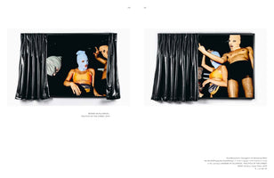 A two-page spread from a book, showing two photographs of an art installation. The installation is a black frame with a shiny black vinyl curtain partially open. In the dark space behind the curtain, several people wearing colorful balaclavas and minimal clothing pose and gesture in different configurations in each photo.