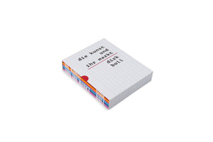 An angled, high-view shot of a thick book in a slipcase on a white background. The slipcase is designed to look like lined notebook paper, with the German title Die Kunst und ihr Markt and the author Dirk Boll printed in a black typewriter font. The side of the case is visible, revealing a colorful design with horizontal bands of orange, blue, and pink, and a red semi-circle cutout.