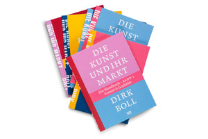A fanned-out stack of colorful books against a white background. The book on top has a pink, red, and blue cover with the German title DIE KUNST UND IHR MARKT by Dirk Boll in white lettering.