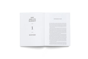 A book lies open on a white surface, viewed from directly above. The left page is a title page for chapter one, reading ART AND ITS MARKET and HISTORY. The right-hand page is the introduction to the book.