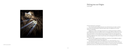 A two-page spread from a book. On the left, a vertical photograph shows beams of sunlight streaming down into a dark, rocky cave from an opening in the ceiling. A caption identifies it as Blombos cave, South Africa. On the right is a page of text with the headline Delving into our Origins by Carlos Duarte.