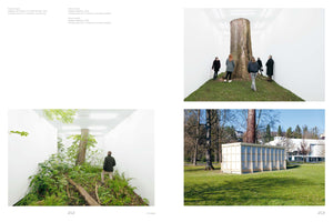 A two-page spread from a book displaying three photographs of an art installation. The top right photo shows people inside a white gallery room, standing on a grassy mound around a large tree trunk that goes through the ceiling. The bottom left shows a man in a similar room filled with a lush patch of forest floor and a tree. The bottom right photo shows the exterior of a simple, box-like wooden structure built around a tree on a green lawn.