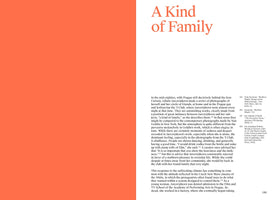A two-page spread from a book. The left page is a solid block of coral-orange. The right page is white with black text, topped by the title A Kind of Family in a large, stylized orange font. The text is an article about the work of photographer Libuše Jarcovjáková in mid-1980s Prague, documenting her circle of friends. Footnotes appear in a smaller column to the right, above the page number 165.