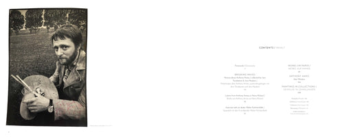 An open book showing a two-page spread. The left page features a black-and-white photograph of the artist Anthony Amies, a bearded man in a jacket, sitting in a field and holding a palette and paintbrushes. The right page displays the book's table of contents, titled CONTENTS / INHALT, with section titles in both English and German.