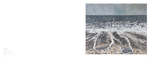 A two-page spread from an art book. The left page contains text, and the right page features a painting of a moody seascape. The artwork shows white sea foam receding over a dark pebble beach under a choppy grey sea and an overcast sky.