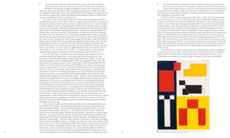 An open art book displays a two-page spread. The left page has text in German, and the right has text in English alongside a color reproduction of Leon Polk Smith’s 1943 painting, OK Territory. The geometric abstract artwork consists of interlocking red, yellow, black, and white rectangular shapes.