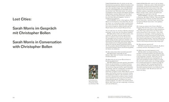 A two-page spread from a publication with the title Lost Cities: Sarah Morris in Conversation with Christopher Bollen. The interview text is presented in two columns, German on the left and English on the right. On the left page, a small color photo shows humorist Art Buchwald playing tennis.