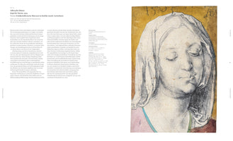 An open art book displaying a two-page spread on Albrecht Dürer's 1503 drawing, Head of Mary. The left page features German text. The right page shows the artwork: a charcoal sketch of a woman with her eyes closed and head tilted down. She wears a white veil, and her expression is somber and serene against a golden-yellow background.