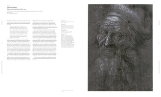 An open art book displays Albrecht Dürer's 1521 drawing, Head of a 93-year-old Man. The detailed black and white portrait on the right page shows an elderly man with a wrinkled face, a long, flowing beard, and a soft cap, gazing forward. The left page contains descriptive text in German.