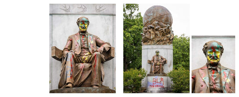 A collage of three photos showing a bronze statue of a seated man splattered with colorful paint. The left and right images are close-ups of the paint on the statue's face and body. The center image shows the full monument, with graffiti including the letters BLM spray-painted on its stone base.