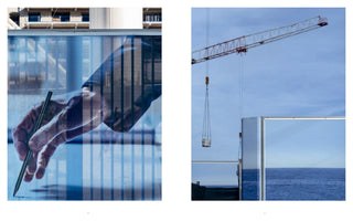 A diptych contrasting architectural design with its final construction. The left image is a double exposure of a hand drawing with a pencil, overlaid with a blue-toned image of a building under construction. The right image shows a crane against a blue sky, lifting large mirrored panels that reflect the blue ocean below.