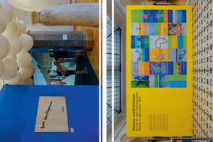 A diptych showing two views of an art exhibition. On the left, a blue wall displays a large photograph of two people posing horizontally, alongside a framed handwritten note and a sculpture of white spheres. On the right, a large yellow banner with a grid of colorful posters hangs over a tiled floor, advertising an exhibition about art for the 1972 Munich Olympic Games.