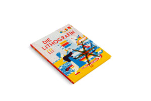 A hardcover book, Die Lithografin by Gaby Bazin, is set at an angle on a white background. The cover features a colorful, graphic illustration in red, yellow, and blue, depicting a woman with blue hair working with lithography printing rollers and a large, multi-colored star-shaped design.