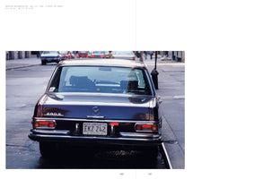 A C-print photograph from a book, dated July 17, 1980, showing the rear of a vintage, dark maroon Mercedes-Benz 280 S parked on a wet city street. The car's Florida license plate, EKZ 242, is visible on the chrome bumper. In the background, other cars and pedestrians are out of focus.