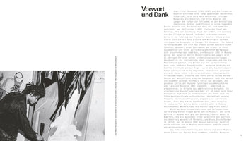 A page from a book featuring a black and white photograph of artist Jean-Michel Basquiat in his studio in 1982. He is shown in profile, with his signature dreadlocks, intensely focused on applying white paint with a brush to a large, abstract canvas. The image is placed next to a body of text in German.
