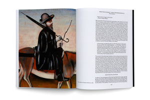 An open art book showing a two-page spread. The left page features a full-page painting, Doctor on a Jackass, depicting a man in a dark coat and hat with a beard, riding a donkey. The right page contains an essay about the artist Niko Pirosmanashvili.